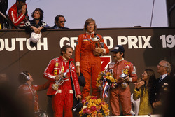 James Hunt, Hesketh, 1st position, Niki Lauda, Ferrari, 2nd position and Clay Regazzoni, Ferrari, 3rd position, on the podium