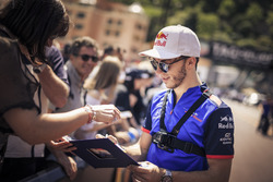 Pierre Gasly, Scuderia Toro Rosso signs autographs for the fans