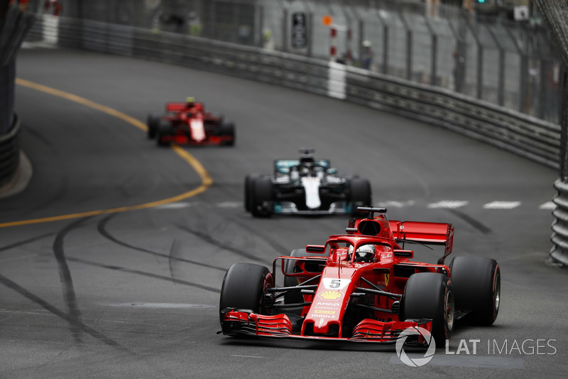 Sebastian Vettel, Ferrari SF71H, leads Lewis Hamilton, Mercedes AMG F1 W09 and Kimi Raikkonen, Ferrari SF71H