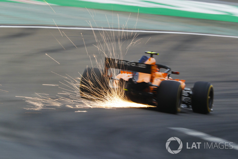 Sparks fly from the car of Stoffel Vandoorne, McLaren MCL33 Renault