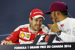 (L to R): Sebastian Vettel, Ferrari and Lewis Hamilton, Mercedes AMG F1 in the FIA Press Conference