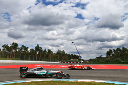 Nico Rosberg, Mercedes AMG F1 W07 Hybrid passes Sebastian Vettel, Ferrari SF16-H