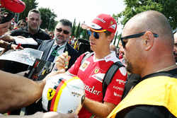 Sebastian Vettel, Ferrari signs autographs for the fans