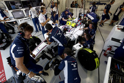 The team work on the car of Valtteri Bottas, Williams FW38 Mercedes, in the garage