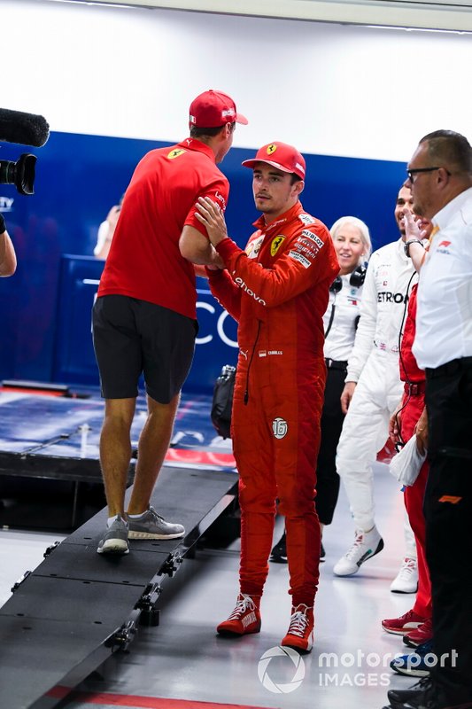 Sebastian Vettel, Ferrari, congratulates pole man Charles Leclerc, Ferrari