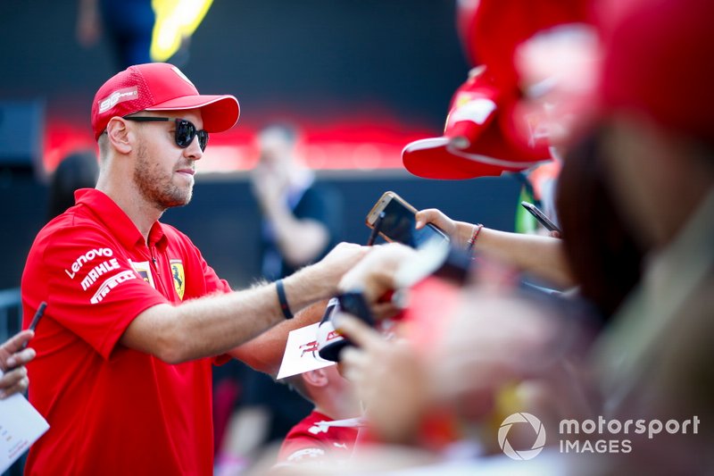 Sebastian Vettel, Ferrari signs an autograph for a fan 