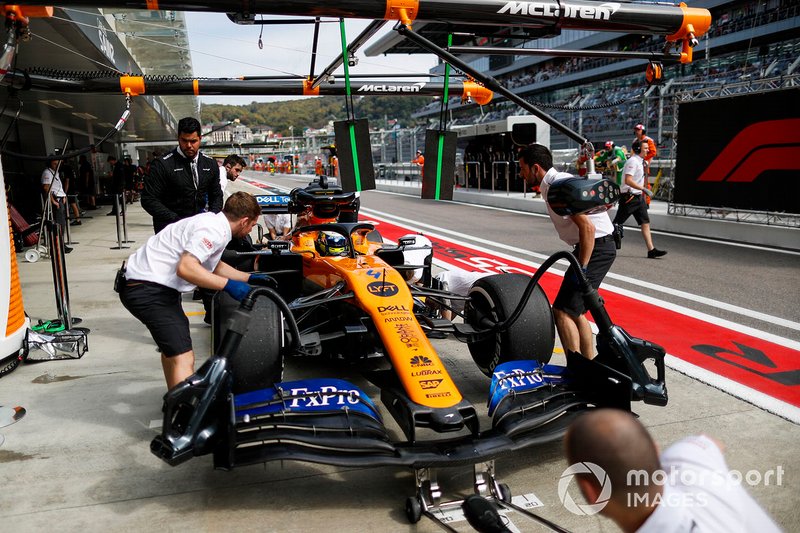 Lando Norris, McLaren MCL34, in the pits during practice