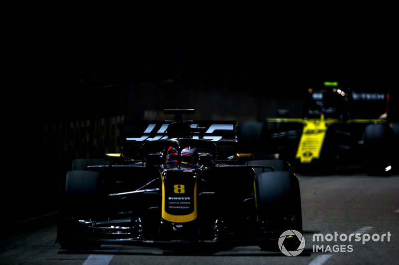 Romain Grosjean, Haas F1 Team VF-19, leads Nico Hulkenberg, Renault F1 Team R.S. 19