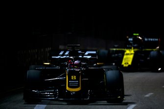 Romain Grosjean, Haas F1 Team VF-19, leads Nico Hulkenberg, Renault F1 Team R.S. 19