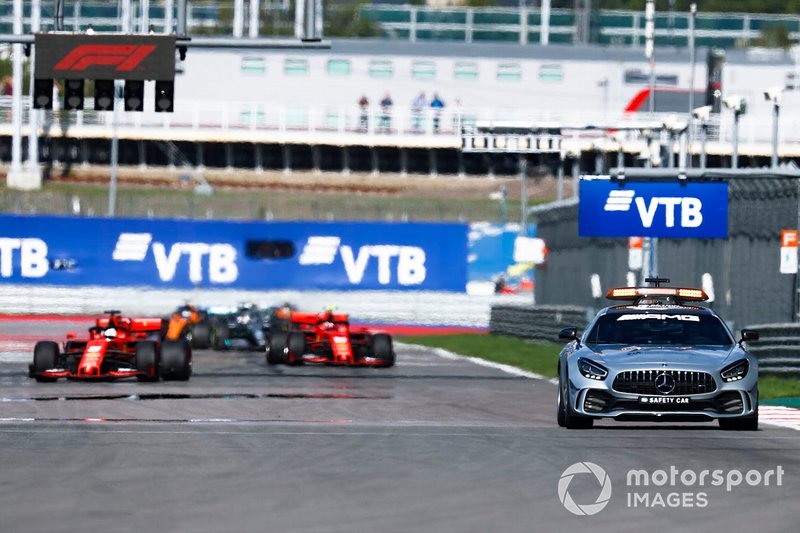 The Safety Car leads Sebastian Vettel, Ferrari SF90, Charles Leclerc, Ferrari SF90, Lewis Hamilton, Mercedes AMG F1 W10, and the rest of the field