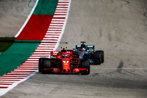 Kimi Raikkonen, Ferrari SF71H, leads Lewis Hamilton, Mercedes AMG F1 W09 EQ Power+