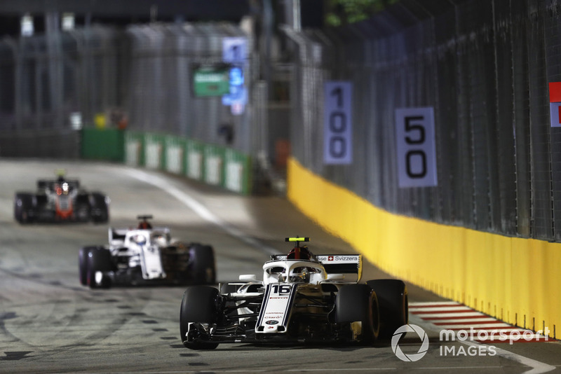 Charles Leclerc, Sauber C37, leads Marcus Ericsson, Sauber C37, and Kevin Magnussen, Haas F1 Team VF-18