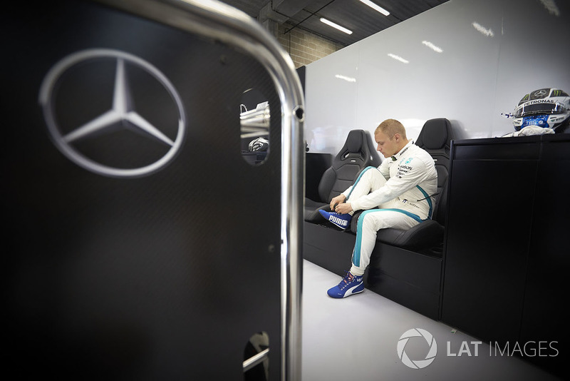 Valtteri Bottas, Mercedes AMG F1, adjusts his boot