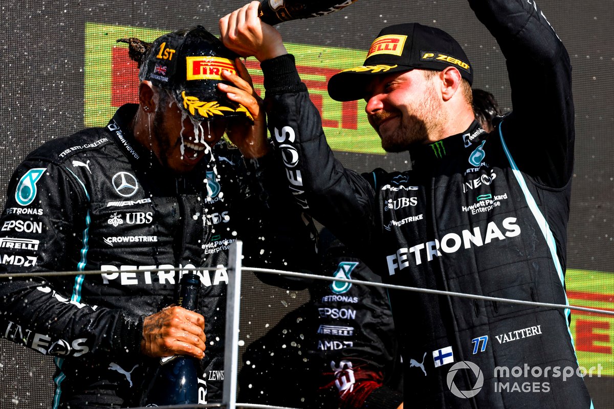 Valtteri Bottas, Mercedes, 3rd position, pours Champagne over Lewis Hamilton, Mercedes, 1st position, on the podium