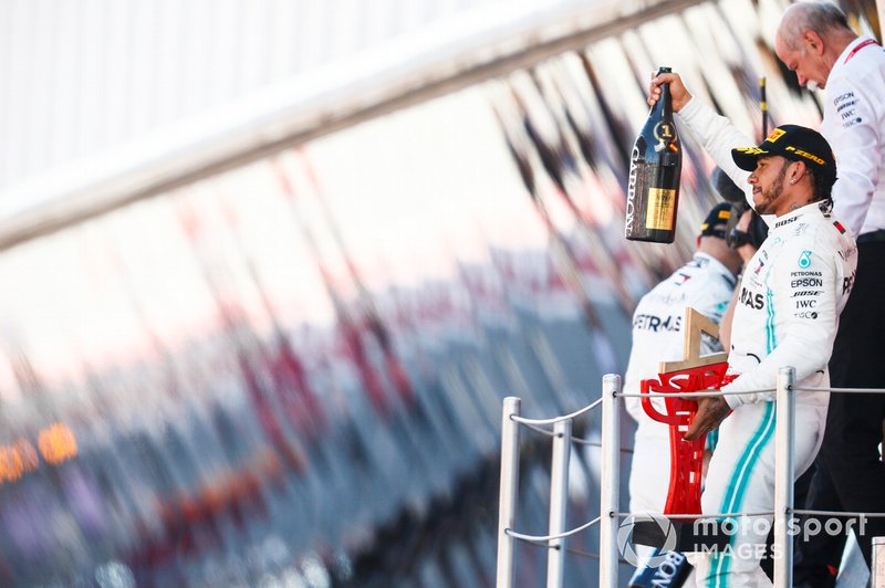 Lewis Hamilton, Mercedes AMG F1, 1st position, with his Champagne