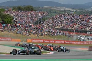 Lewis Hamilton, Mercedes AMG F1 W10, leads Valtteri Bottas, Mercedes AMG W10, Sebastian Vettel, Ferrari SF90, and the rest of the field at the start