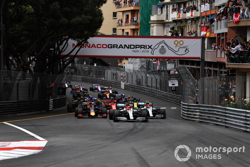 Lewis Hamilton, Mercedes AMG F1 W10, leads Valtteri Bottas, Mercedes AMG W10, Max Verstappen, Red Bull Racing RB15, Sebastian Vettel, Ferrari SF90, Daniel Ricciardo, Renault R.S.19, Kevin Magnussen, Haas F1 Team VF-19, and the rest of the field at the start