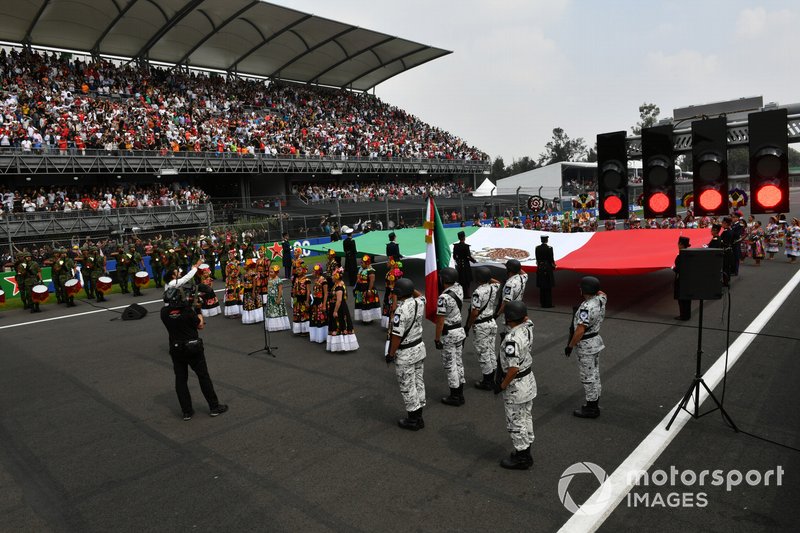 The national anthem is performed during the pre race grid celebrations