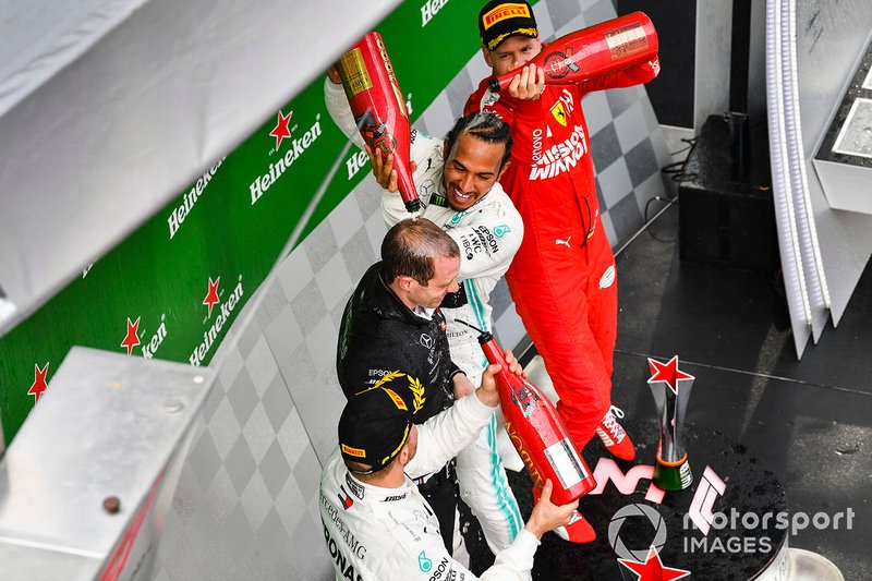 Valtteri Bottas, Mercedes AMG F1, 2nd position, Lewis Hamilton, Mercedes AMG F1, 1st position, and Sebastian Vettel, Ferrari, 3rd position, on the podium