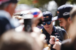 Max Verstappen, Red Bull Racing, and Daniel Ricciardo, Red Bull Racing, sign autographs for fans
