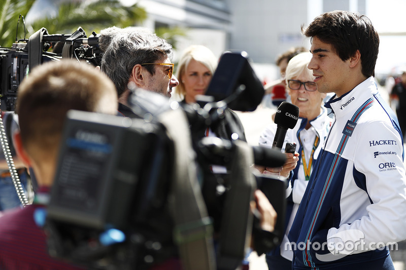 Lance Stroll, Williams, is interviewed by the media