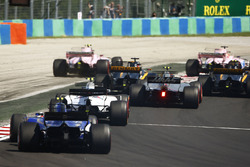 Esteban Ocon, Sahara Force India F1 VJM10, runs wide battling Sergio Perez, Sahara Force India F1 VJM10. Jolyon Palmer, Renault Sport F1 Team RS17, follows ahead of Nico Hulkenberg, Renault Sport F1 Team RS17