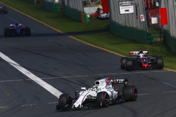 Felipe Massa, Williams FW40, leads Romain Grosjean, Haas F1 Team VF-17