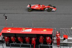 Sebastian Vettel, Ferrari SF70H passes the Ferrari pit wall gantry