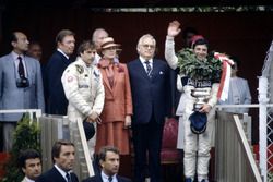 Podium: Race winner Riccardo Patrese, Brabham BT49D-Ford Cosworth, third place (later fifth place) Elio de Angelis, Lotus 91-Ford Cosworth, Princess Grace and Prince Rainier