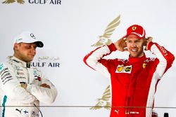 Valtteri Bottas, Mercedes AMG F1, 2nd position, and Sebastian Vettel, Ferrari, 1st position, talk on the podium