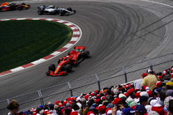 Sebastian Vettel, Ferrari SF71H, leads Valtteri Bottas, Mercedes AMG F1 W09, and Max Verstappen, Red