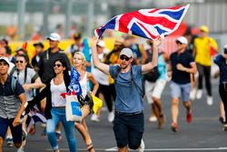 Fans invade the circuit and head towards the podium celebrations