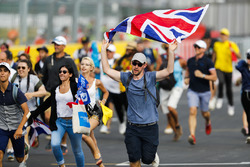 Fans invade the circuit and head towards the podium celebrations