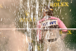 Third place Sergio Perez, Force India celebrates on the podium with the champagne