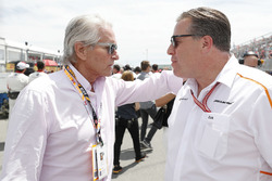 Actor Michael Douglas with Zak Brown, Executive Director, McLaren Technology Group, on the grid
