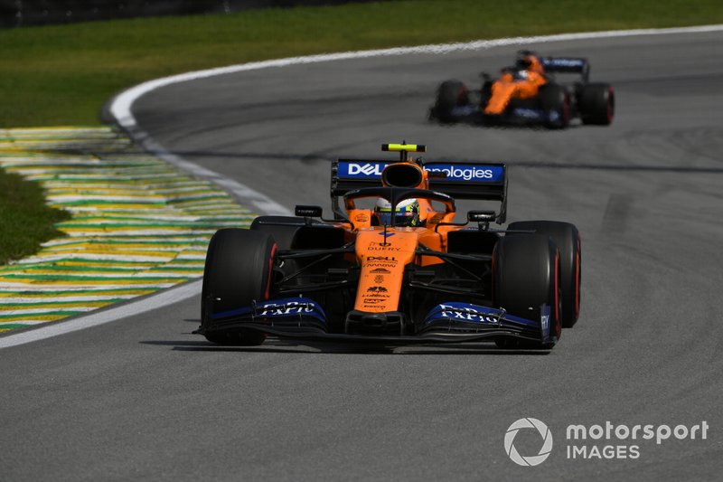 Lando Norris, McLaren MCL34, leads Carlos Sainz Jr., McLaren MCL34