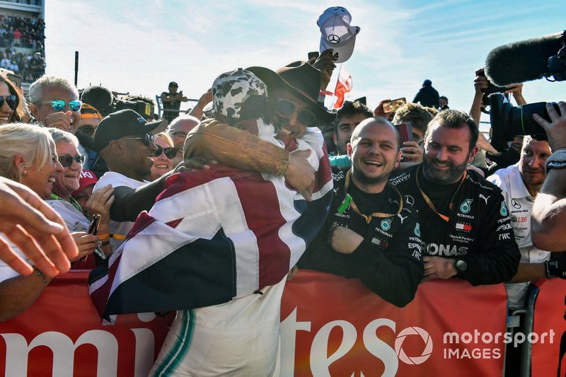 Lewis Hamilton, Mercedes AMG F1, 2nd position, celebrates with actor and friend Matthew McConnaughtey after securing his sixth drivers world championship title