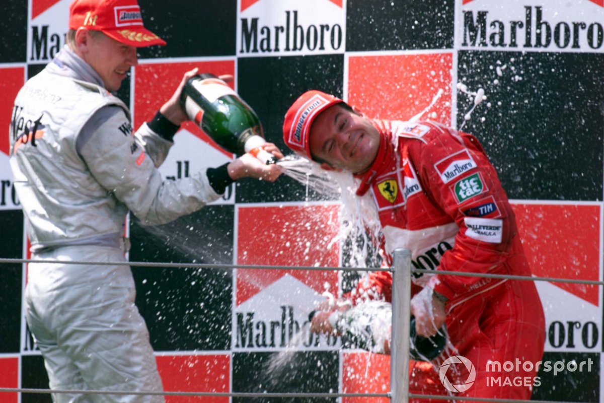 Race winner Mika Hakkinen, McLaren and Rubens Barrichello, Ferrari on the podium