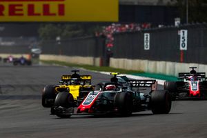 Kevin Magnussen, Haas F1 Team VF-18, leads Nico Hulkenberg, Renault Sport F1 Team R.S. 18, and Romain Grosjean, Haas F1 Team VF-18