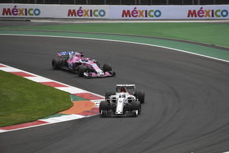 Marcus Ericsson, Sauber C37 leads Sergio Perez, Racing Point Force India VJM11