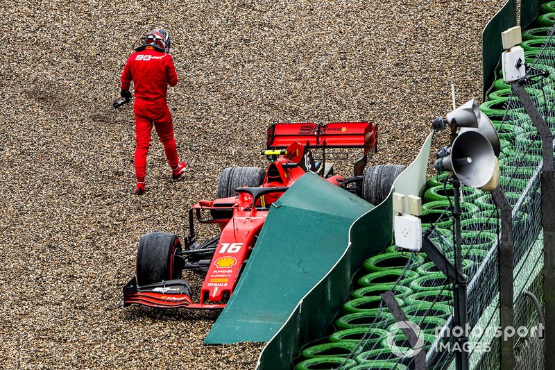 Charles Leclerc, Ferrari, climbs out of his car after crashing out of the race