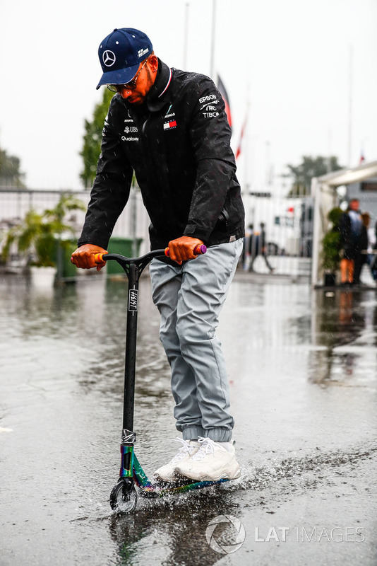 Lewis Hamilton, Mercedes AMG F1, arrives in the paddock