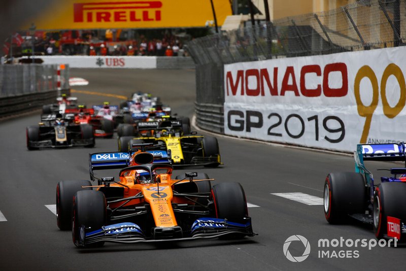 Carlos Sainz Jr., McLaren MCL34, leads Nico Hulkenberg, Renault R.S. 19, and Romain Grosjean, Haas F1 Team VF-19