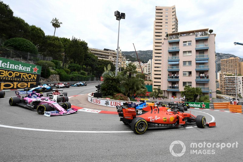 Charles Leclerc, Ferrari SF90, leads Lance Stroll, Racing Point RP19, and Kimi Raikkonen, Alfa Romeo Racing C38
