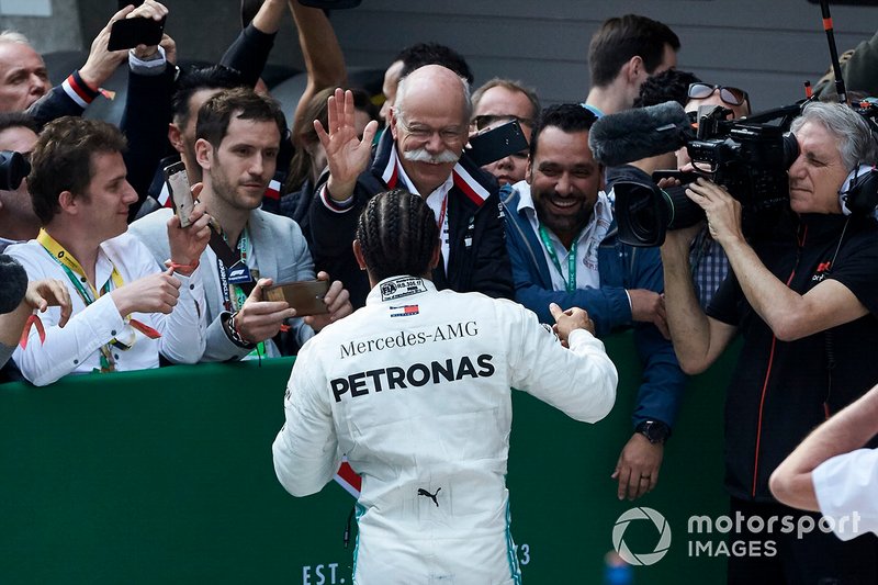 Lewis Hamilton, Mercedes AMG F1, 1st position, celebrates with Dr Dieter Zetsche, CEO, Mercedes Benz, and the Mercedes team in Parc Ferme