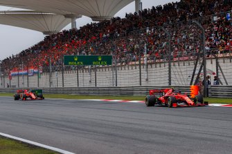 Charles Leclerc, Ferrari SF90, leads Sebastian Vettel, Ferrari SF90