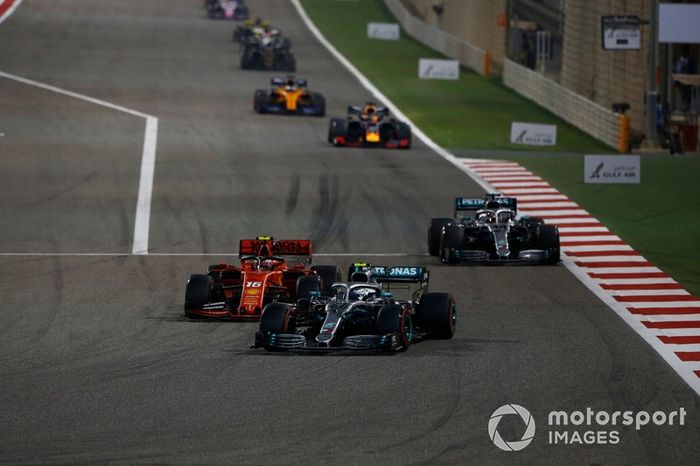 Valtteri Bottas, Mercedes AMG W10, leads Charles Leclerc, Ferrari SF90, and Lewis Hamilton, Mercedes AMG F1 W10