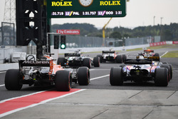 Pierre Gasly, Scuderia Toro Rosso STR12 and Fernando Alonso, McLaren MCL32