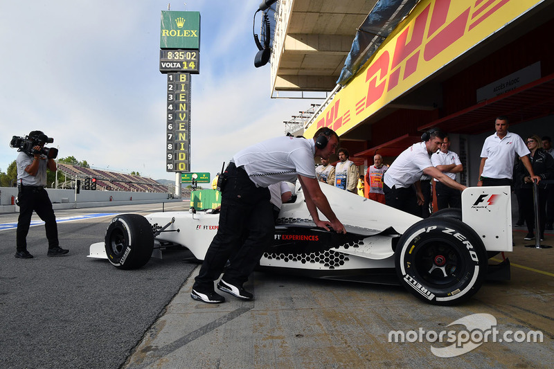 Zsolt Baumgartner, F1 Experiences 2-Seater driver and F1 Experiences 2-Seater passenger Thomas Senecal, Journalist and Presenter for Canal