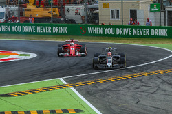 Kevin Magnussen, Haas F1 Team VF-17 locks up and runs wide alongside Sebastian Vettel, Ferrari SF70H